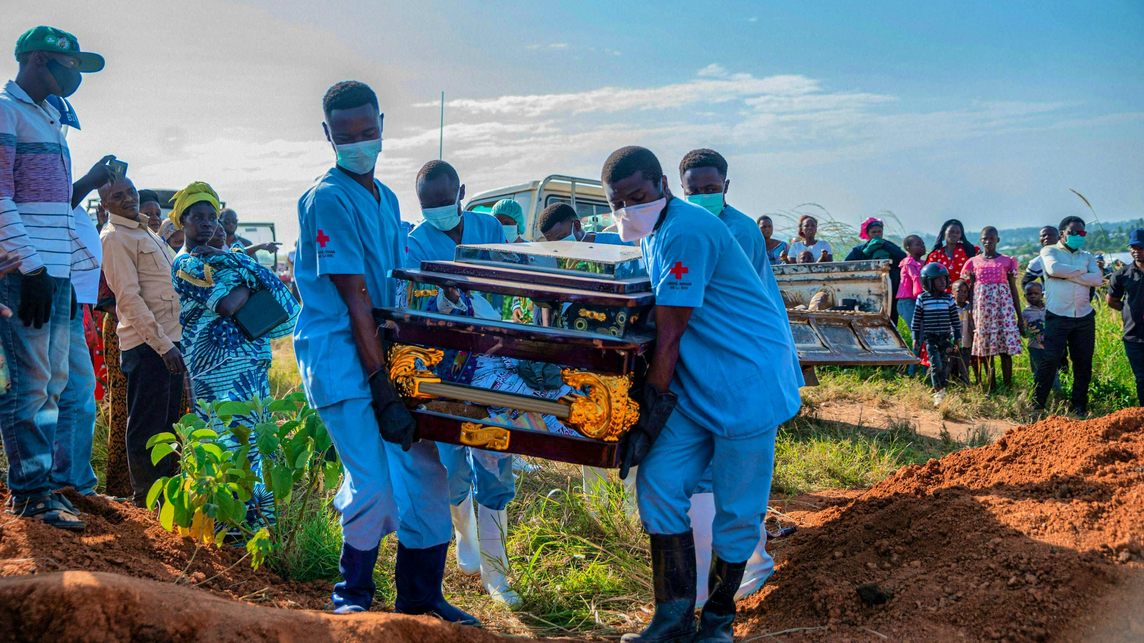 Red Cross workers bury an Ebola victim.
