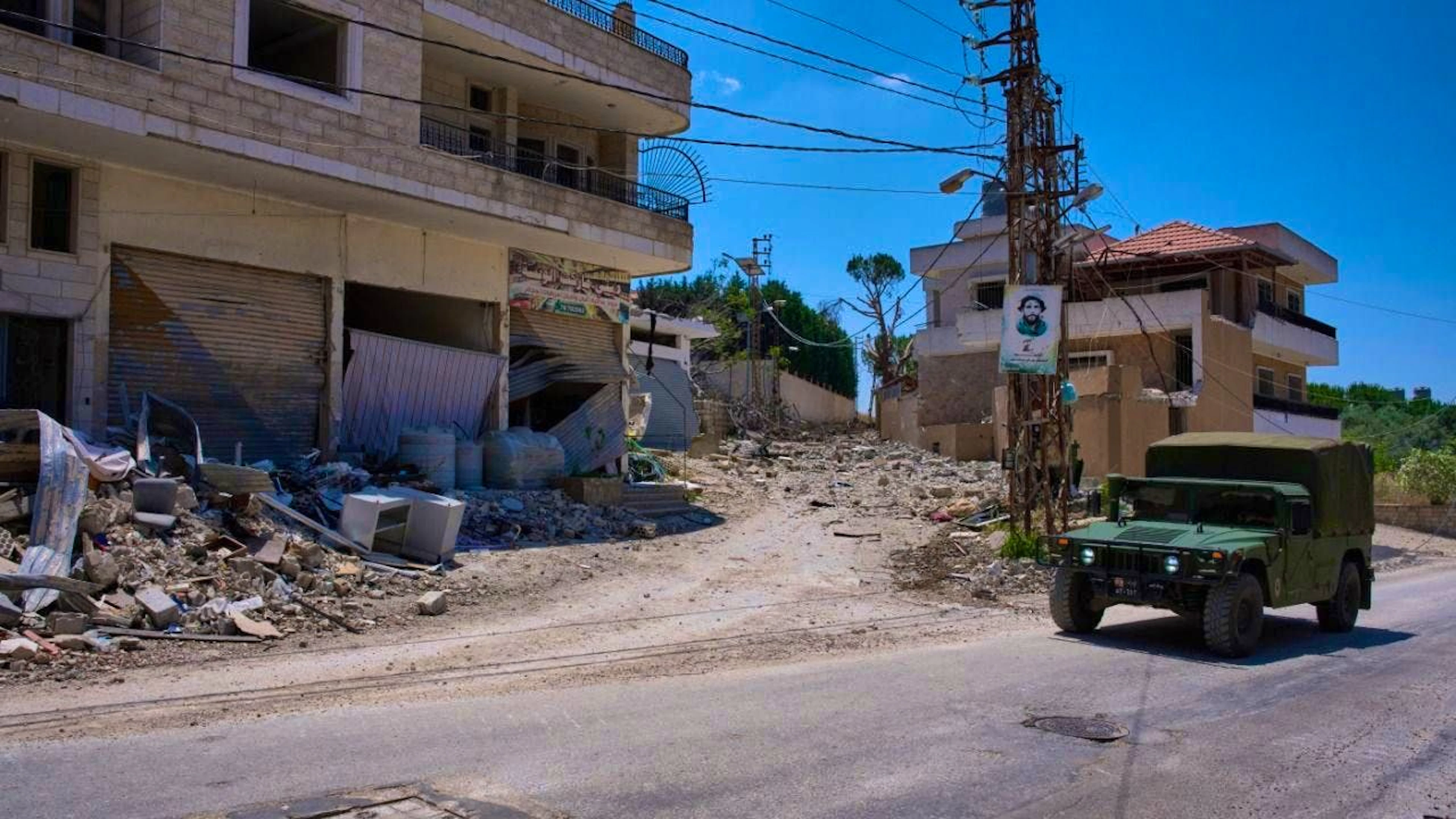 ARCHIVE – A Lebanese Army vehicle drives past damaged buildings in the village of Dibbine in southeastern Lebanon. According to local reports, the Israeli army has continued its attacks in southern Lebanon for the time being, despite the announced framework agreement in the Iran war. Photo: Hassan Ammar/AP/dpa/Archive image