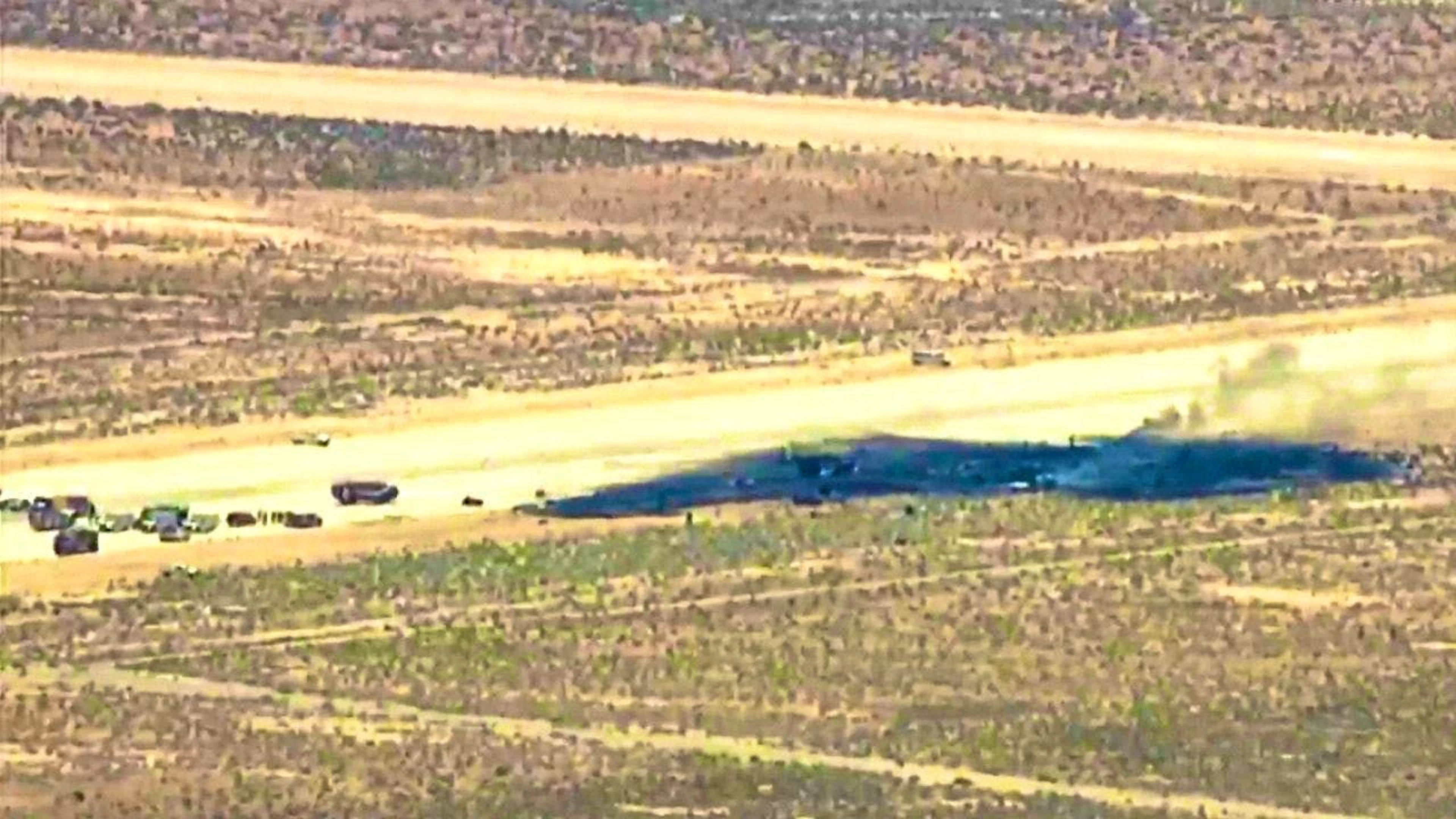 This image is from a video provided by the television station KABC and shows emergency responders at the scene of a plane crash near Edwards Air Force Base in California.