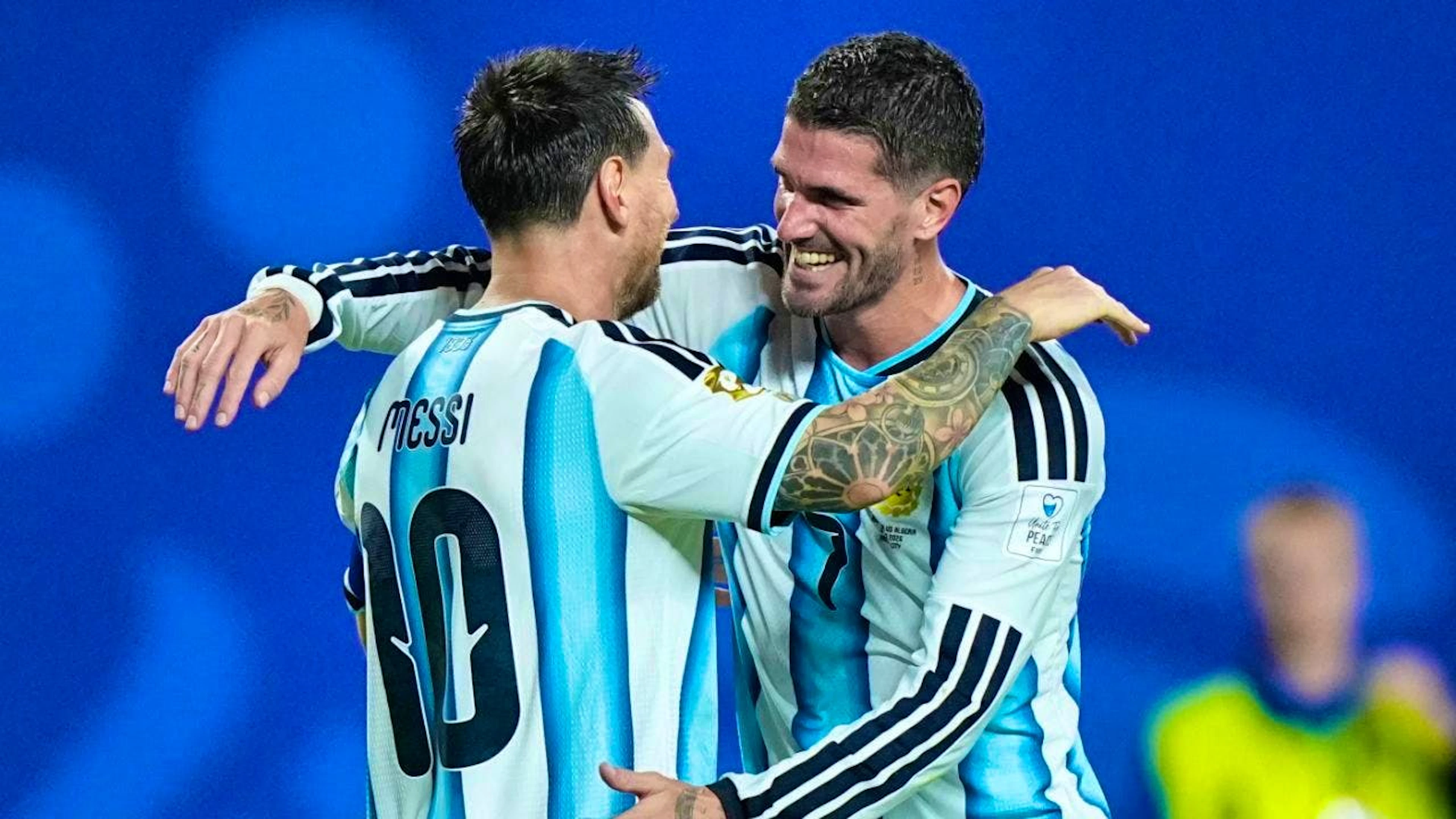 Outstanding once again: Teammate Rodrigo de Paul congratulates Lionel Messi on his hat trick against Algeria