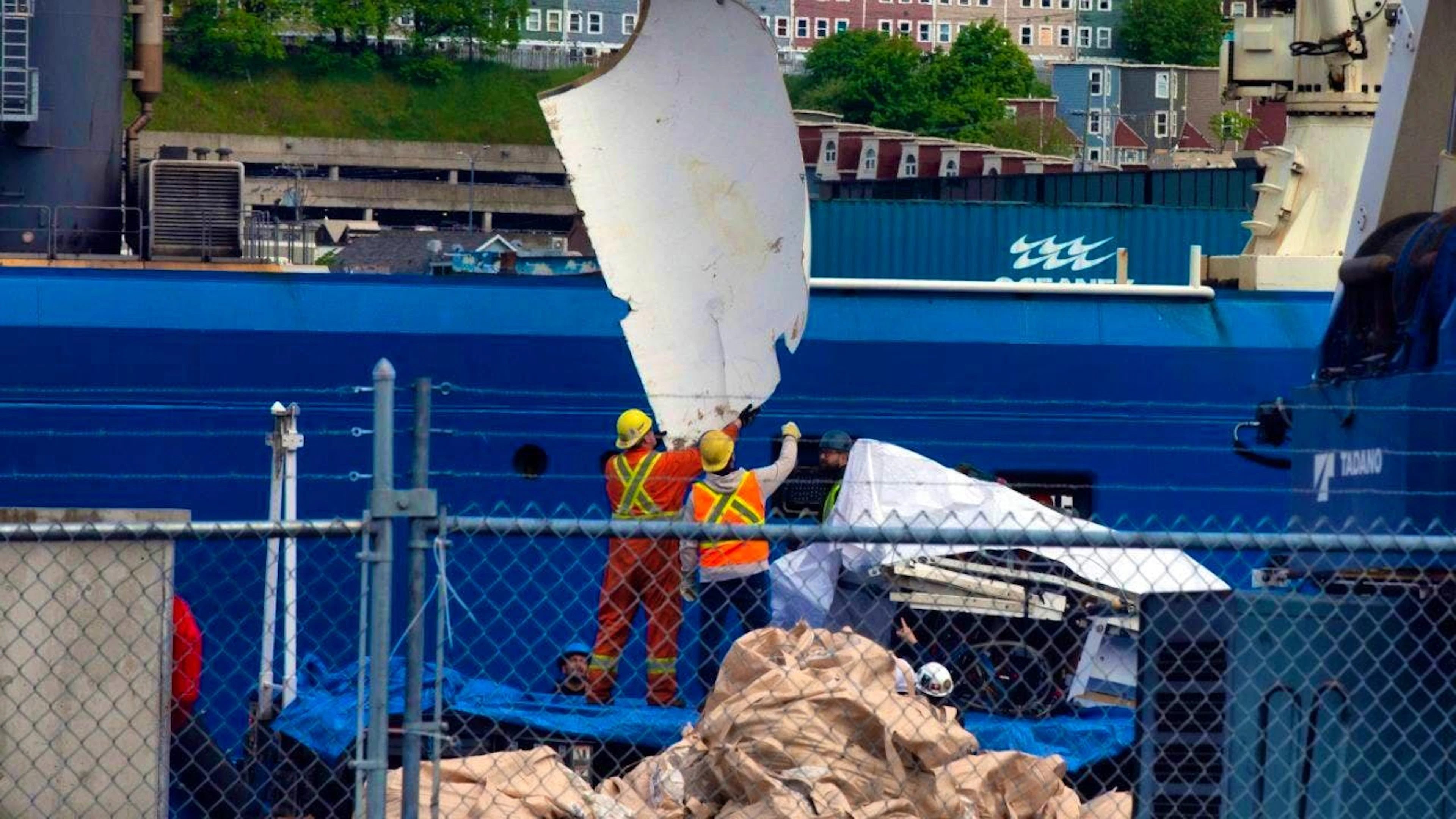 ARCHIVE – Debris from the “Titan” submersible, which was recovered from the seafloor near the wreck of the Titanic, is being unloaded from the ship “Horizon Arctic” at the Canadian Coast Guard pier.