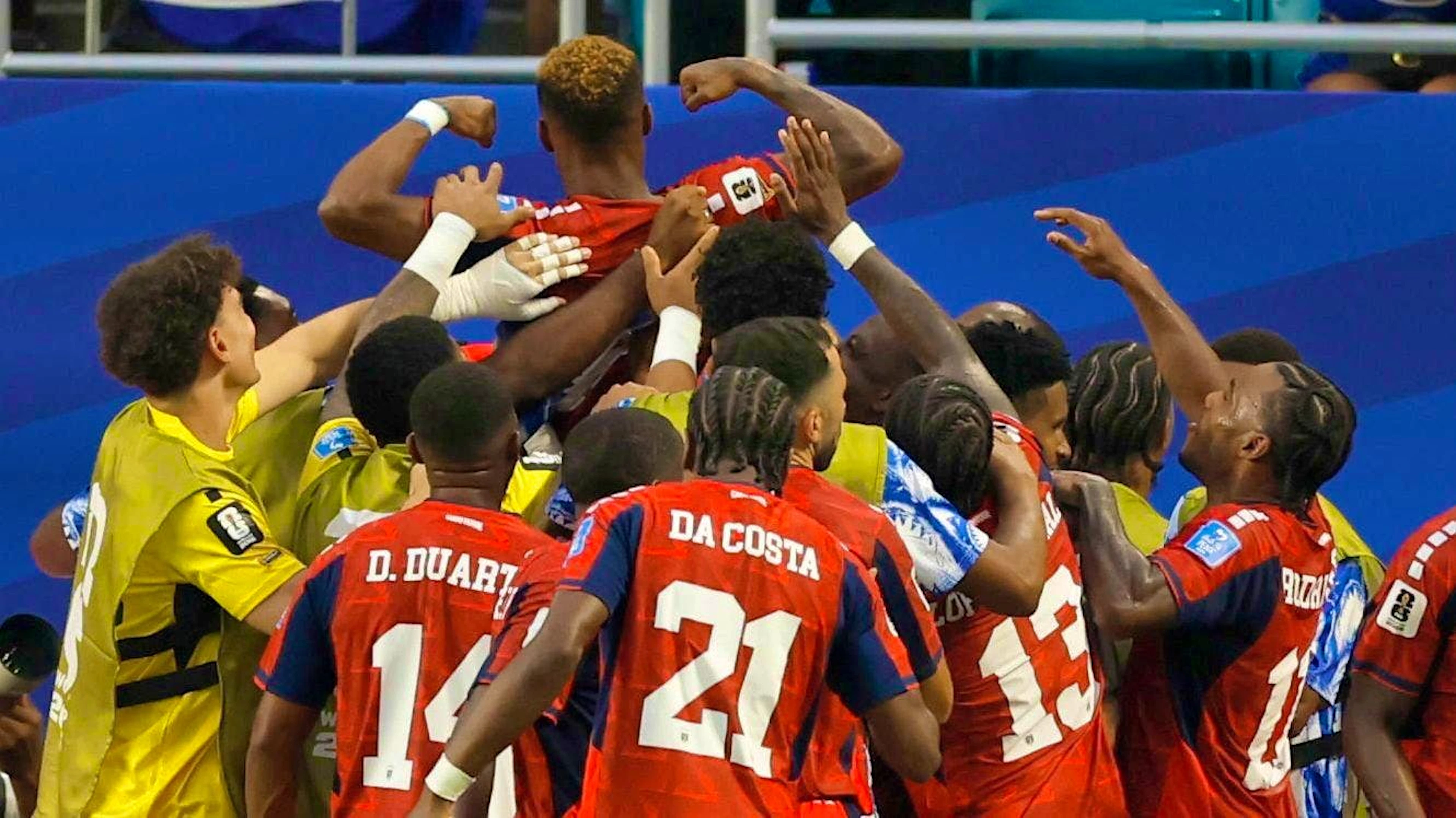 The Cape Verde players celebrate earning a point against Uruguay.