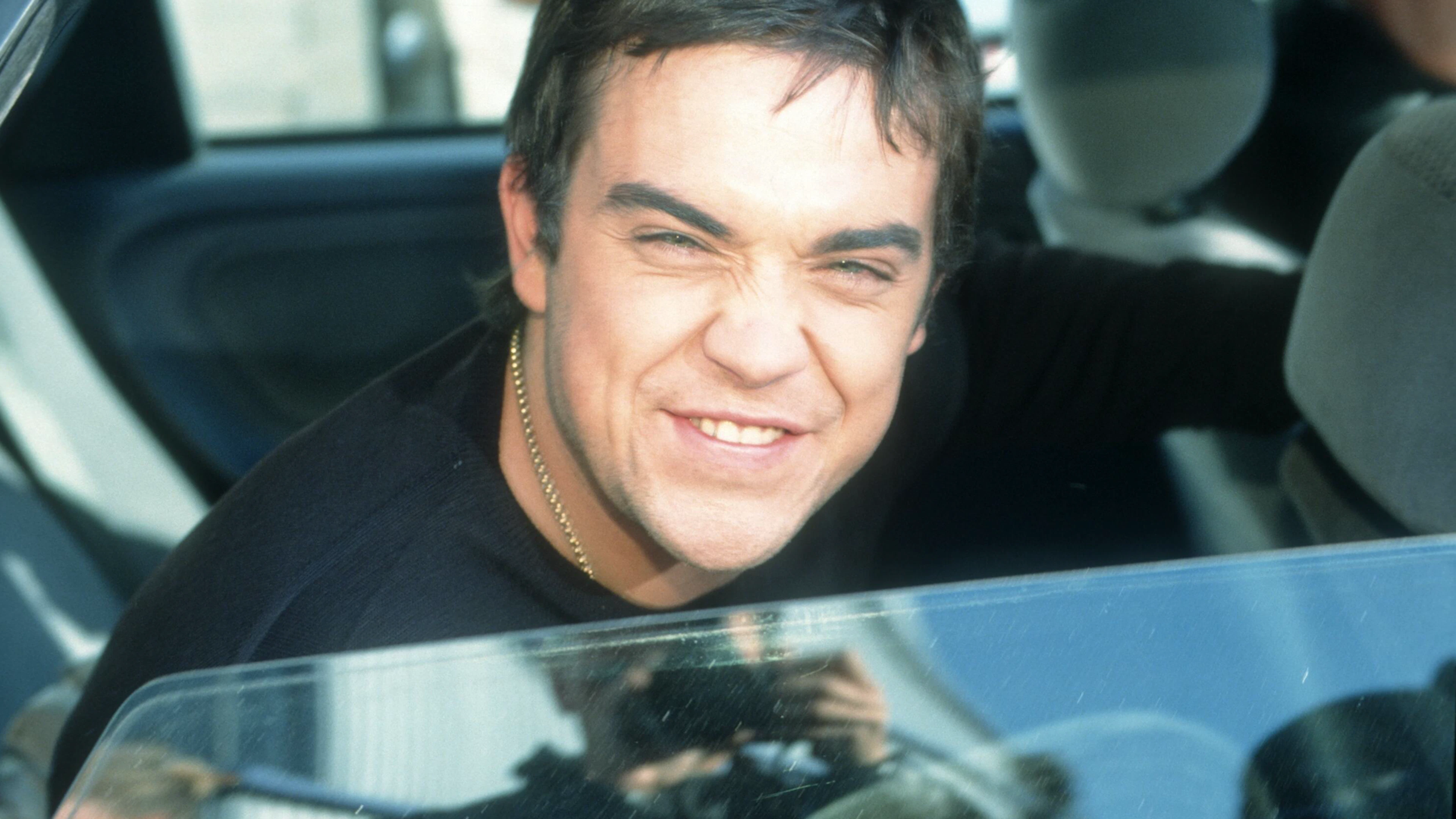 Robbie Williams hat gut lachen: Als dieses Foto 1996 entsteht, hat er Take That bereits verlassen. Seine grössten Erfolge hat er da noch vor sich.