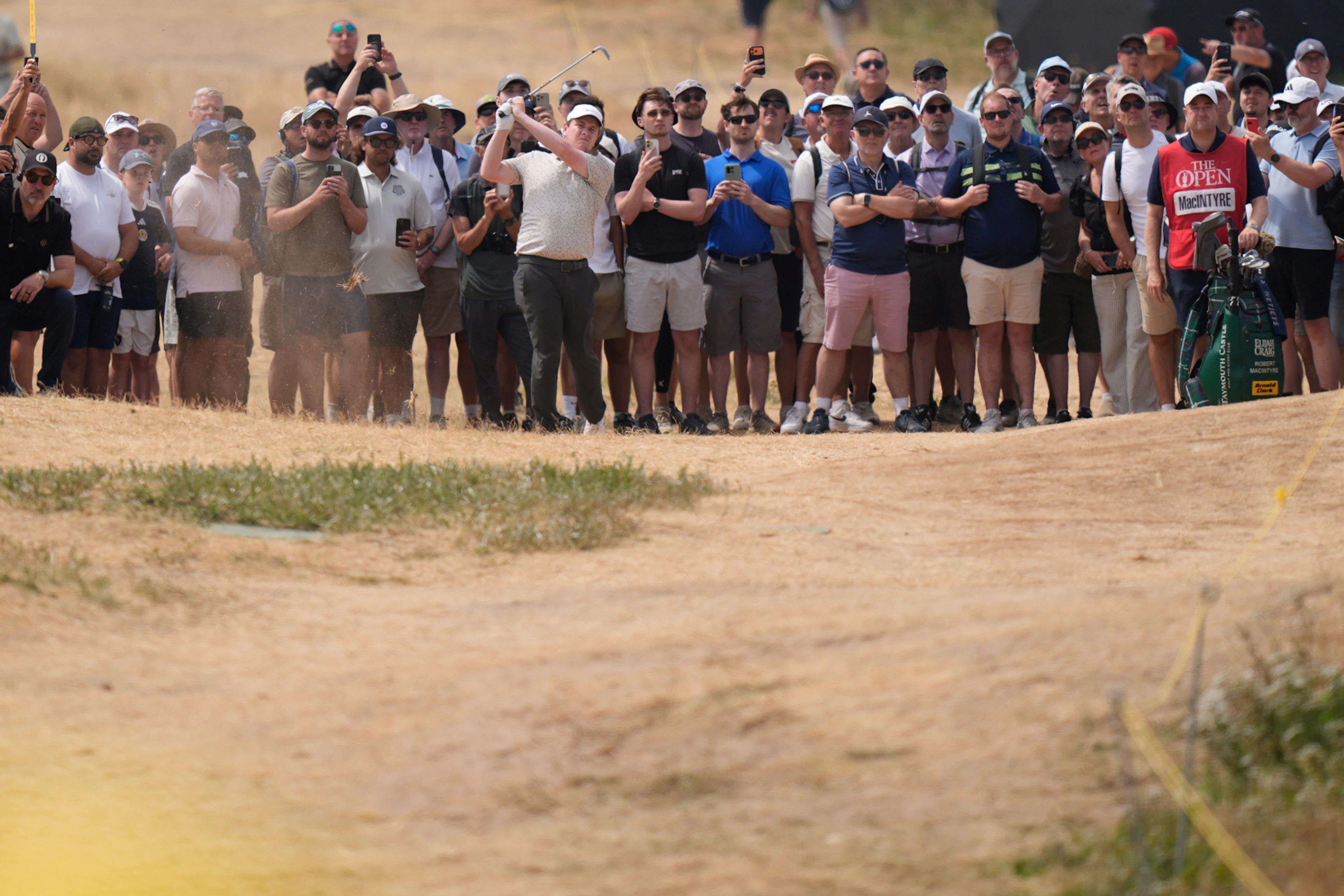 The historic heat wave in England has dried out the Royle Birkdale Golf Course, posing a special challenge for the players.