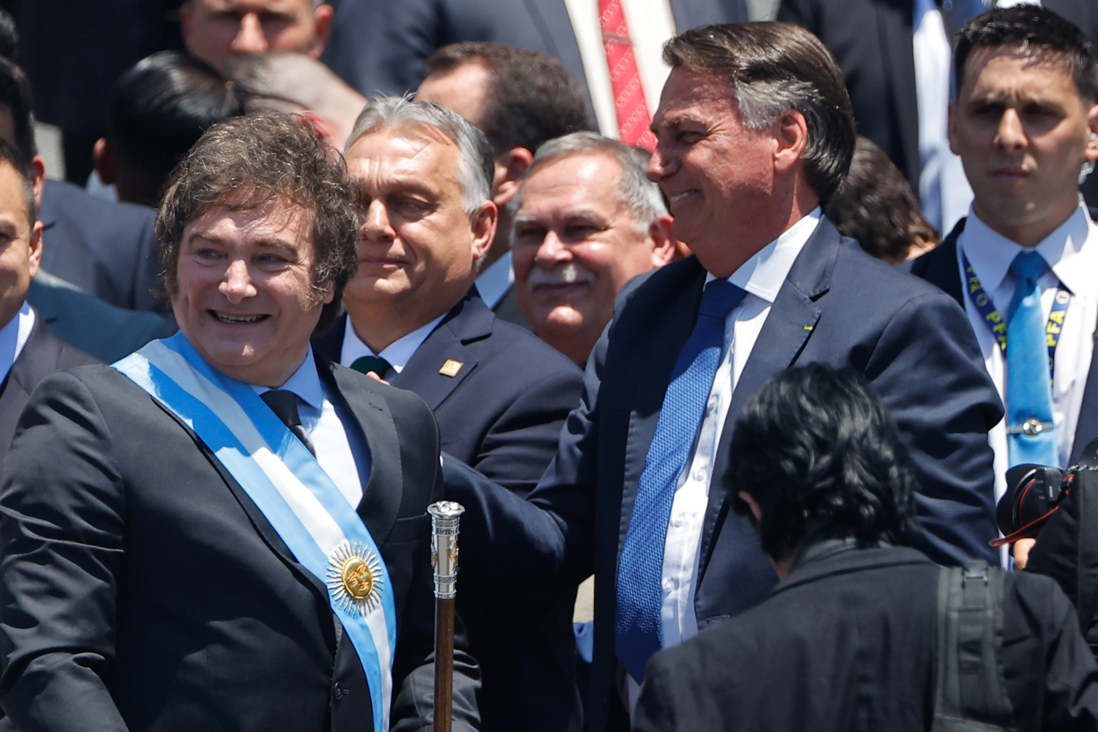 Back when he was still a free man: Argentine President Javier Milei (left) greets former President Jair Bolsonaro (right) in Buenos Aires.