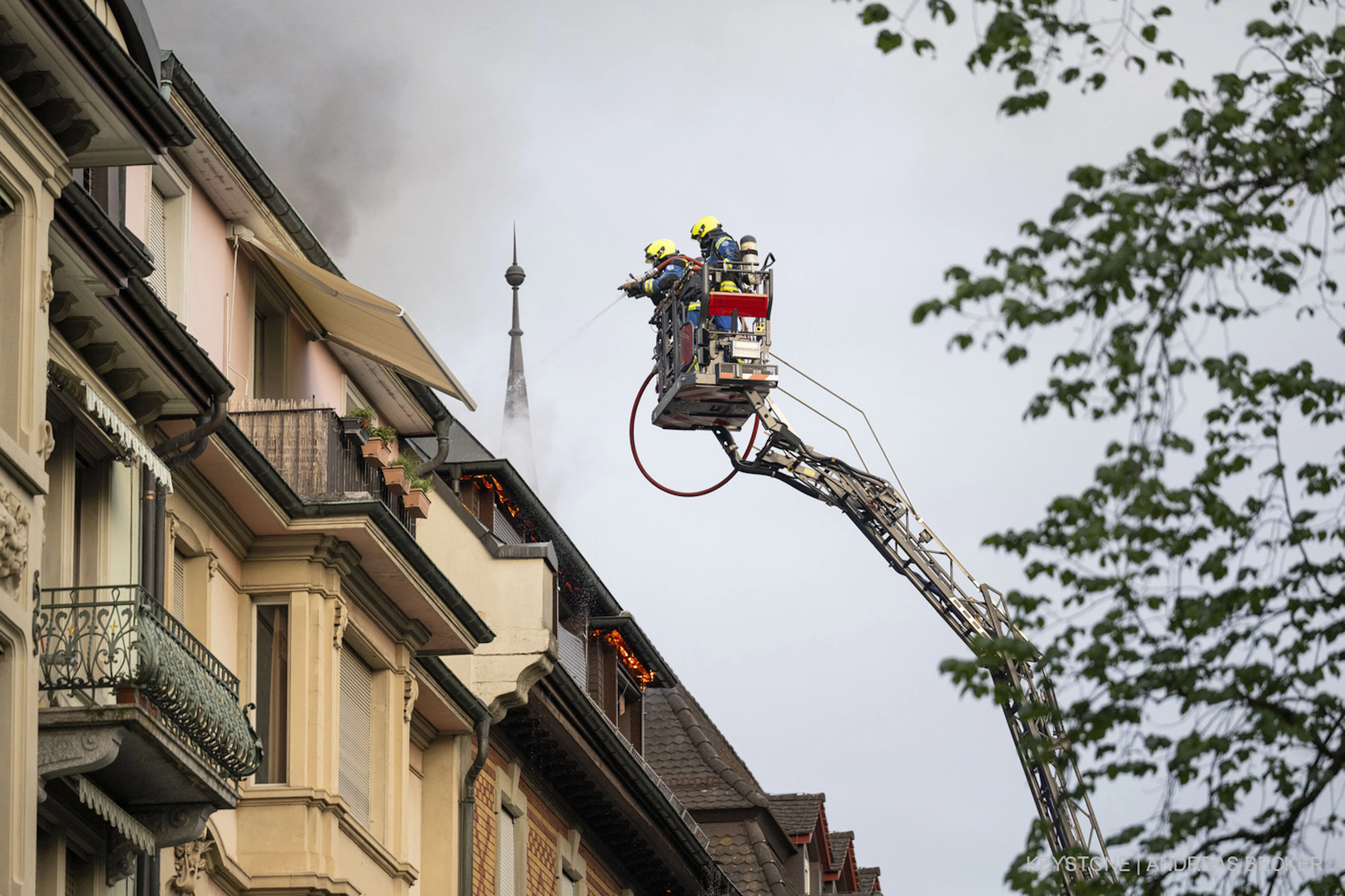 Firefighters are battling the fire in the hotel's attic.