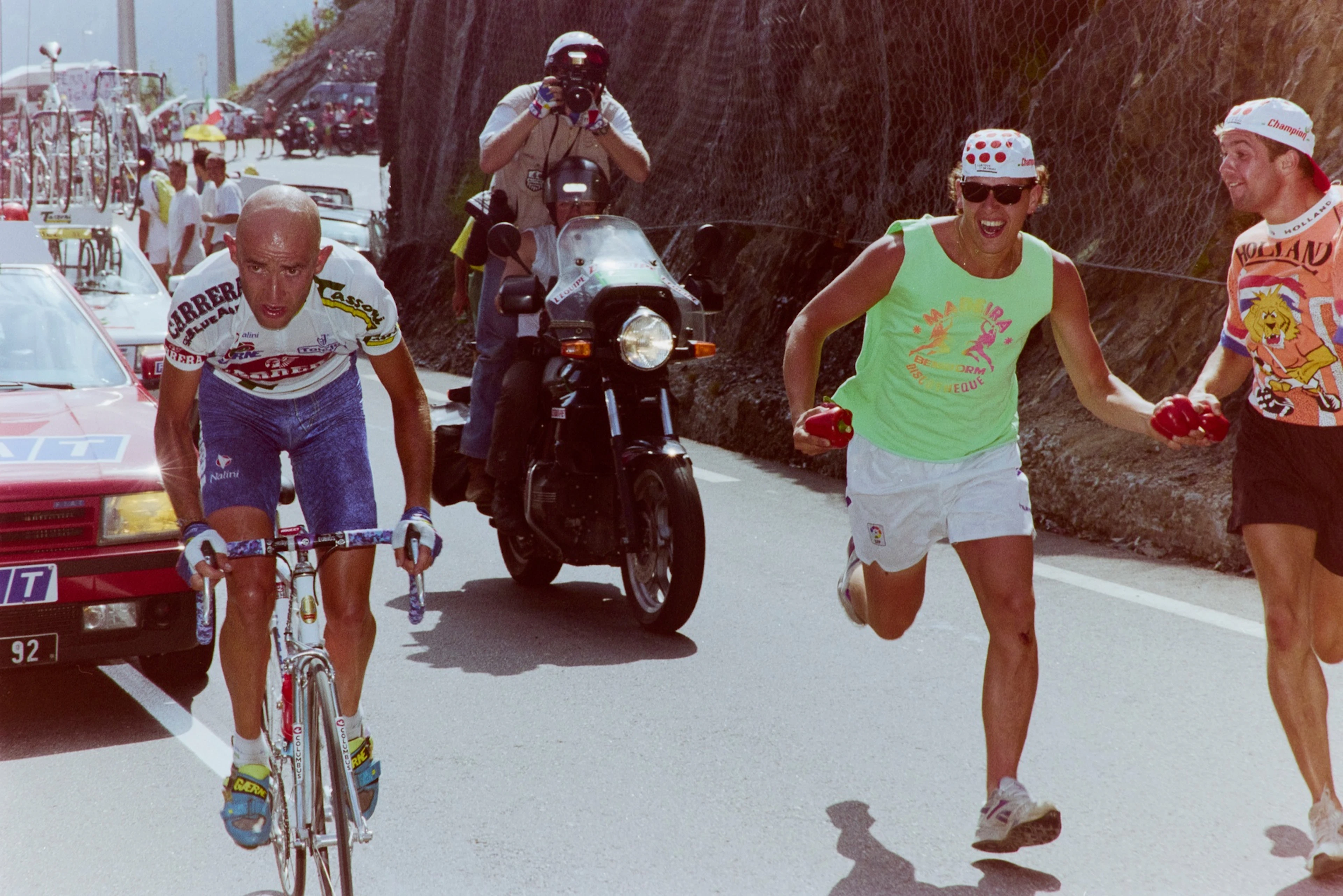 Marco Pantani is cheered on by the fans.