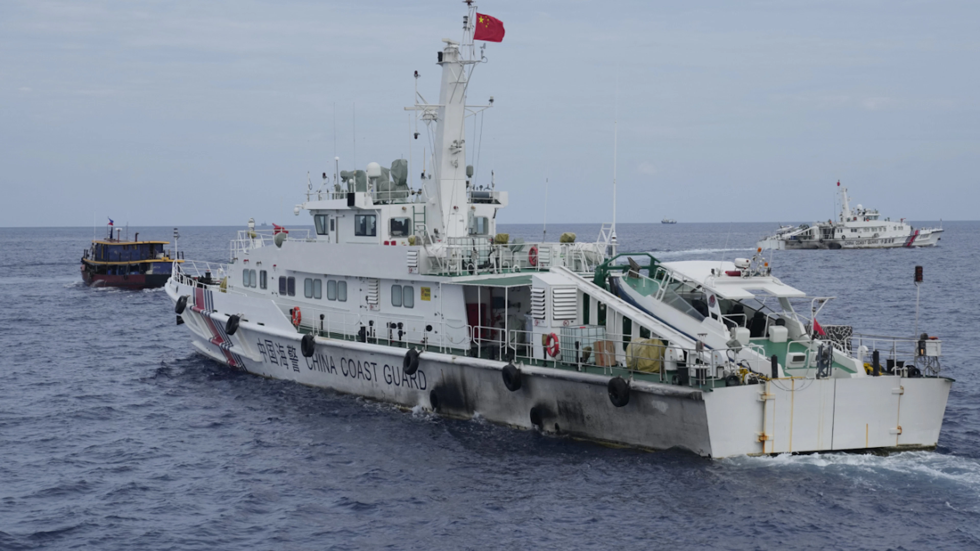ARCHIVE – A Chinese Coast Guard vessel attempts to block the path of a Philippine supply ship (left) as it heads toward Second Thomas Shoal in the disputed South China Sea. Photo: Aaron Favila/AP/dpa