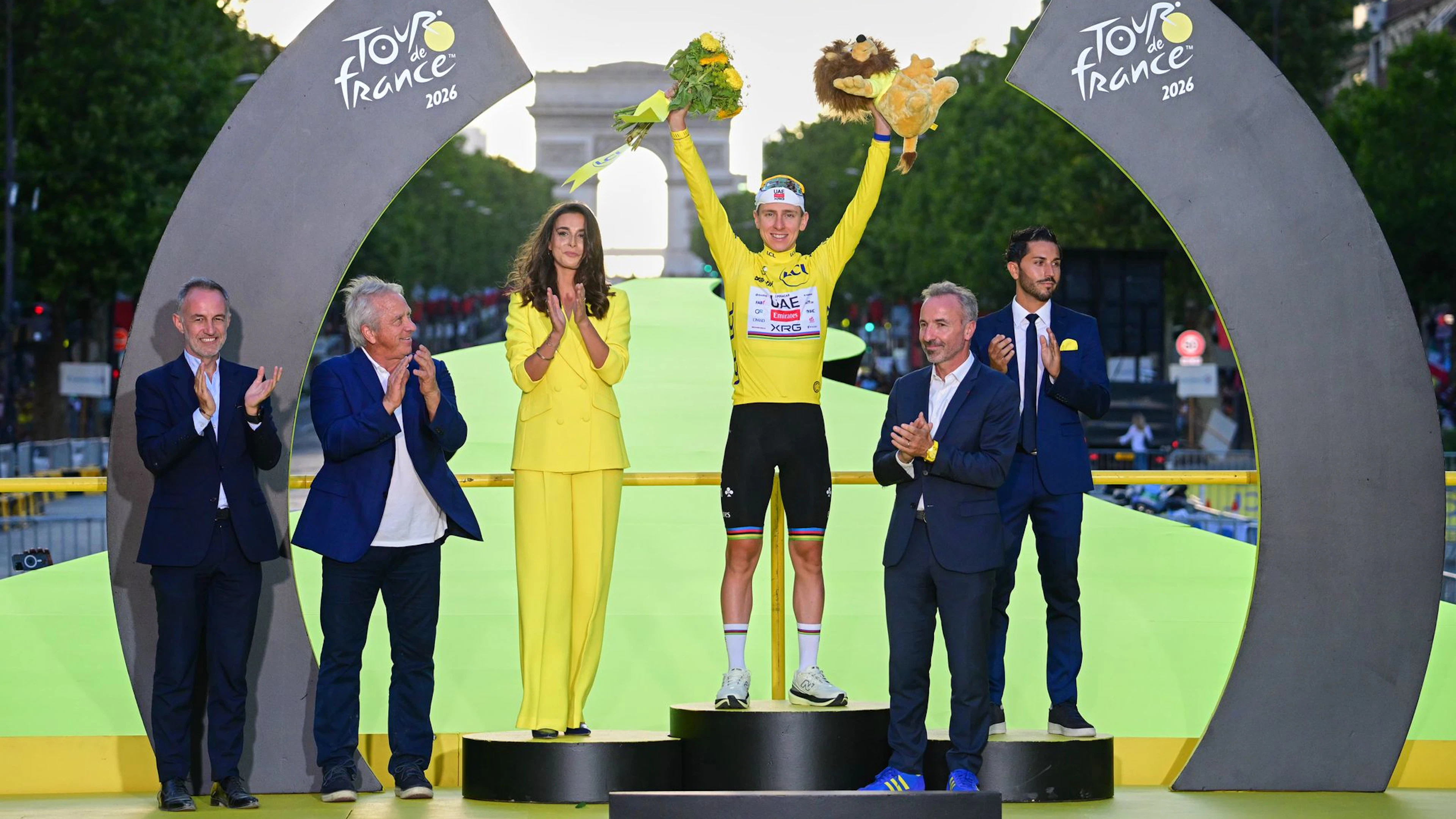 Tadej Pogacar celebrates his fifth overall victory at the Tour. 