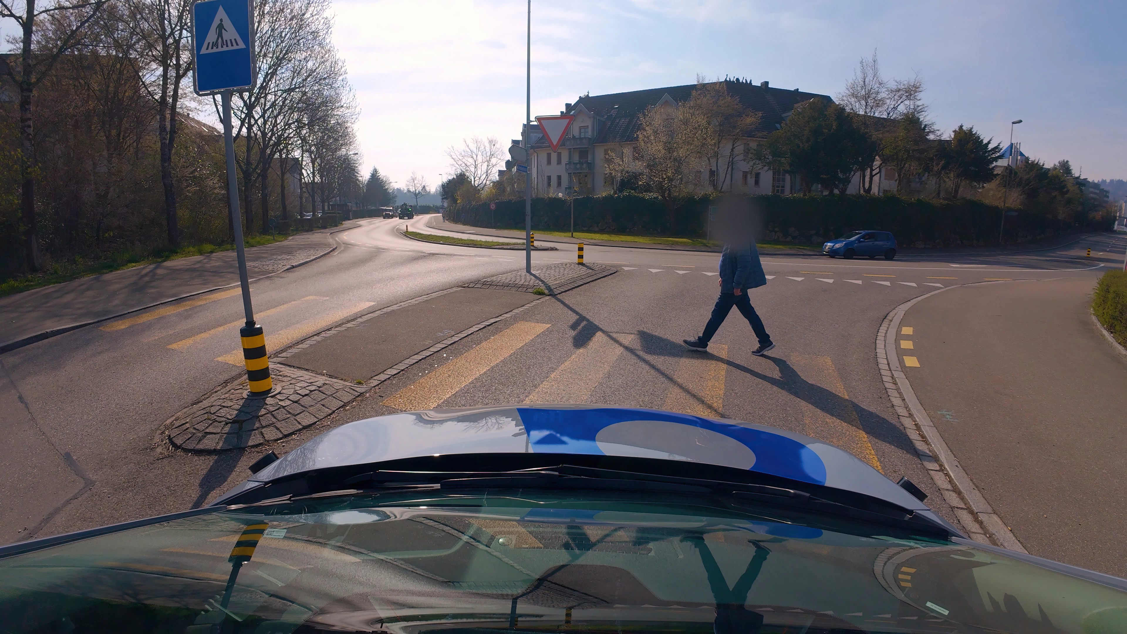If someone wants to cross the street, the car detects the pedestrian and stops.