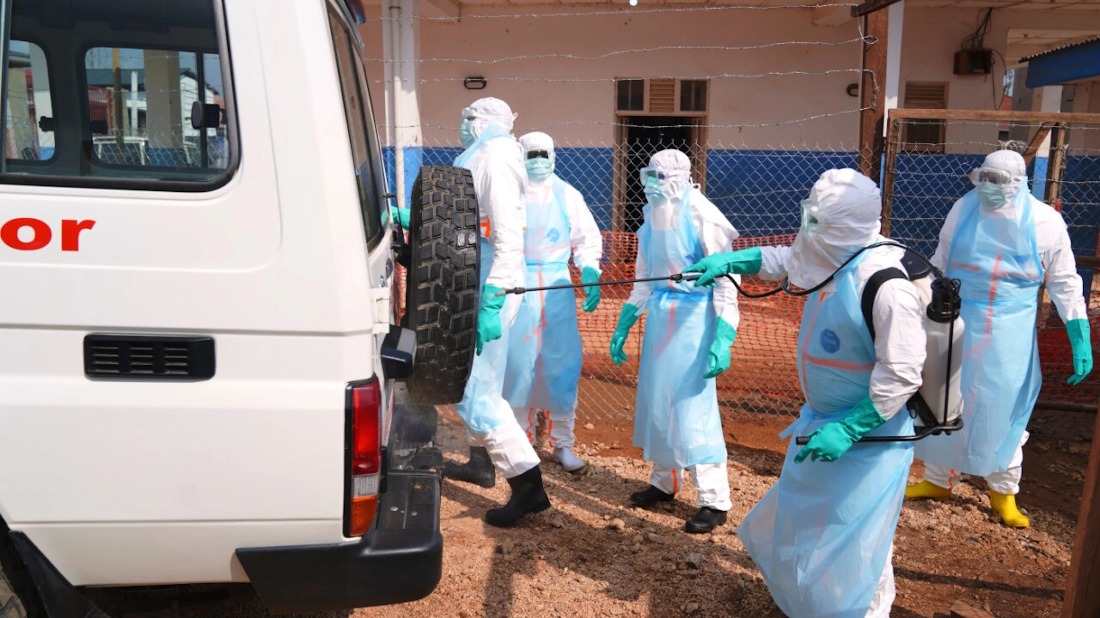ARCHIVE – Medical staff disinfect an ambulance at the Ebola treatment center at Bunia General Hospital. Photo: Dirole Lotsima Dieudonne/AP/dpa