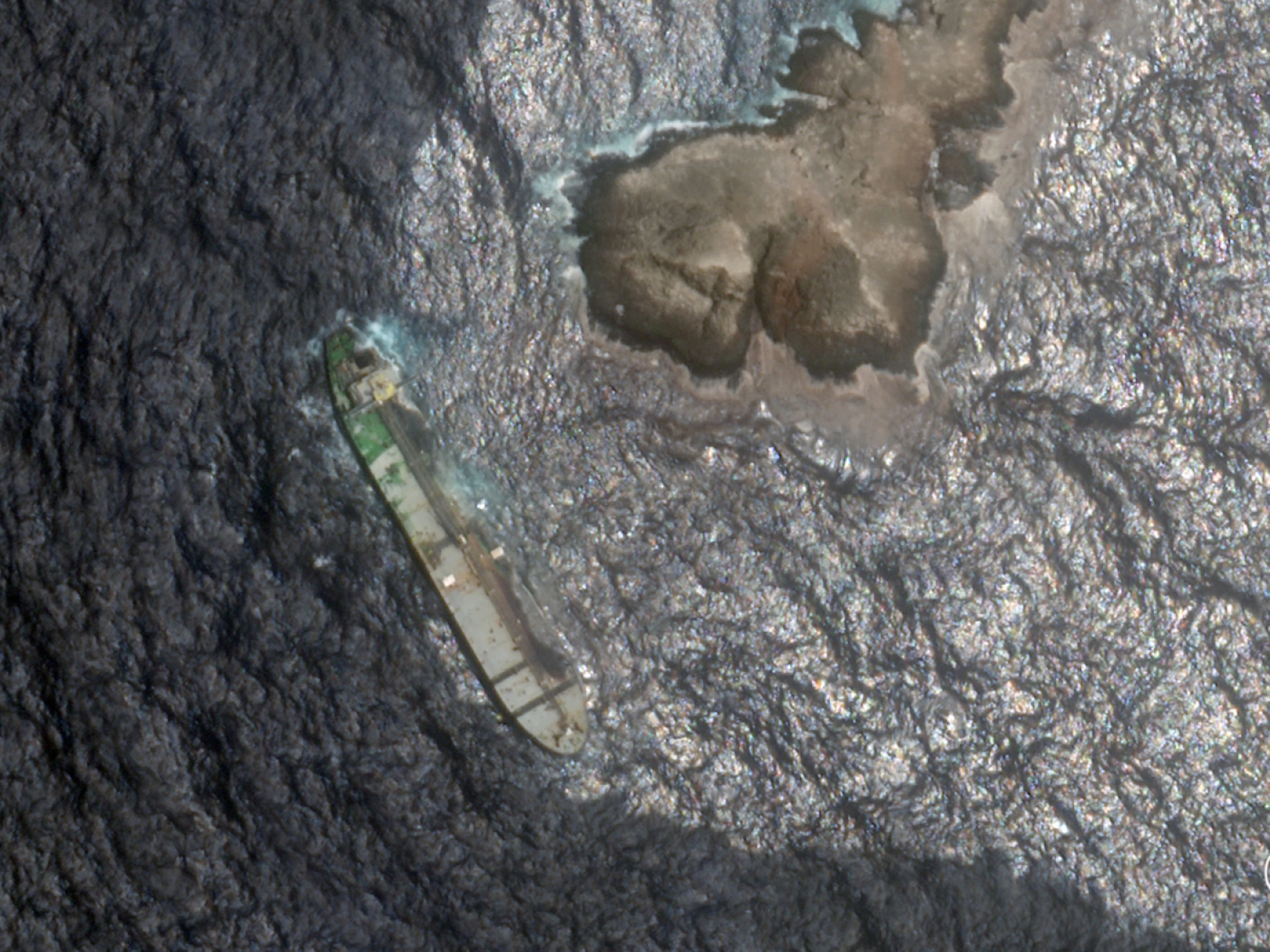 This satellite image shows crude oil leaking from a tanker that ran aground off the coast of Oman.