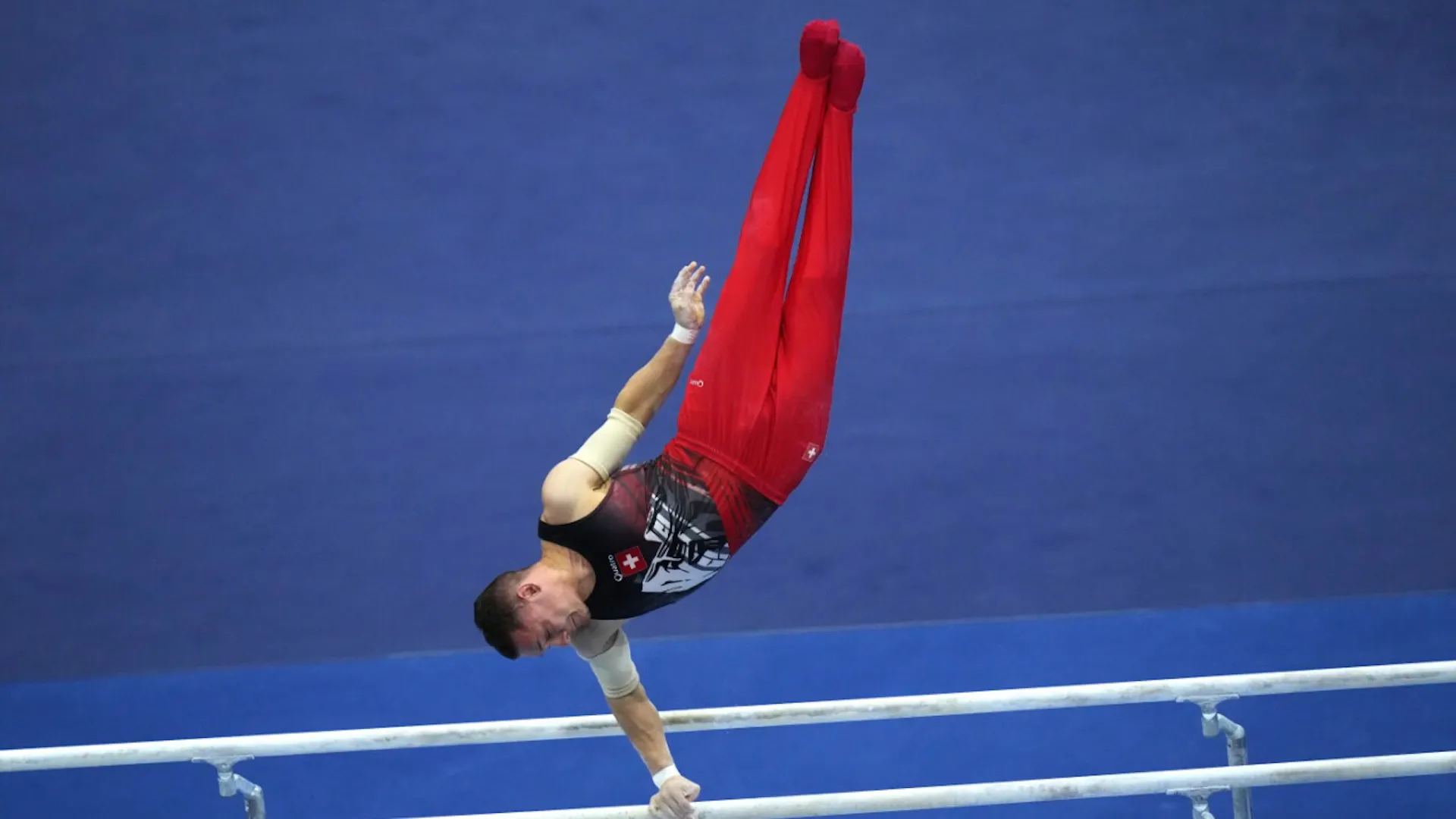 Seifert in the parallel bars and all-around finals; men's team final